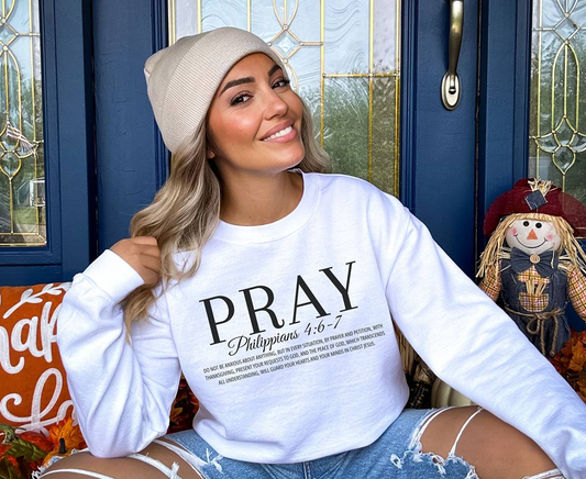 woman wearing a white pray sweatshirt
