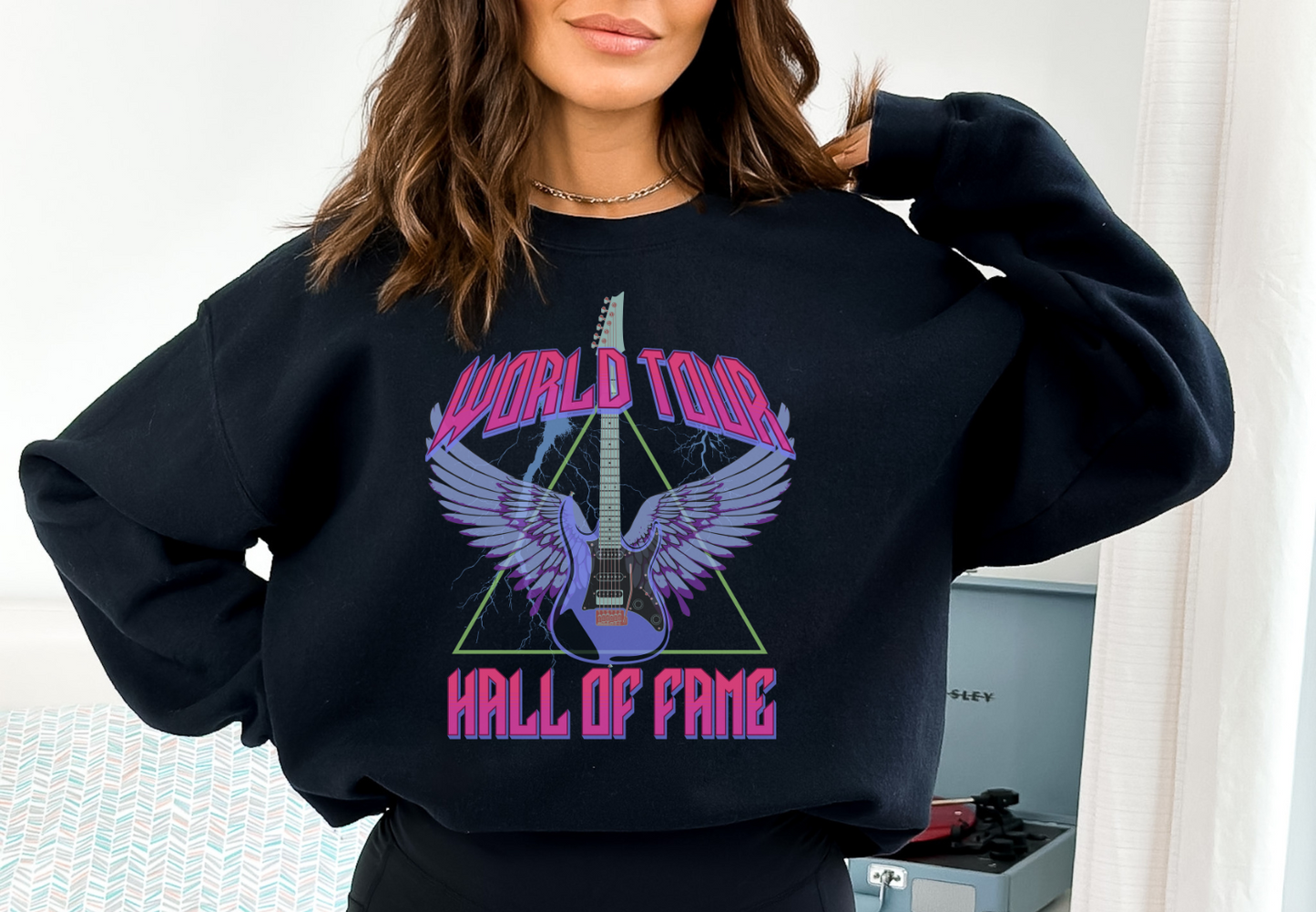 Woman Wearing A Black World Tour Hall Of Fame Graphic Sweatshirt